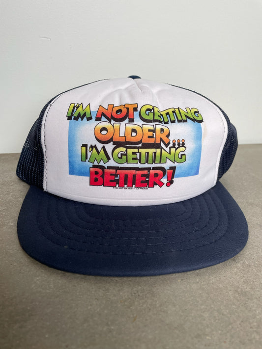 I’m Getting Better Trucker Hat