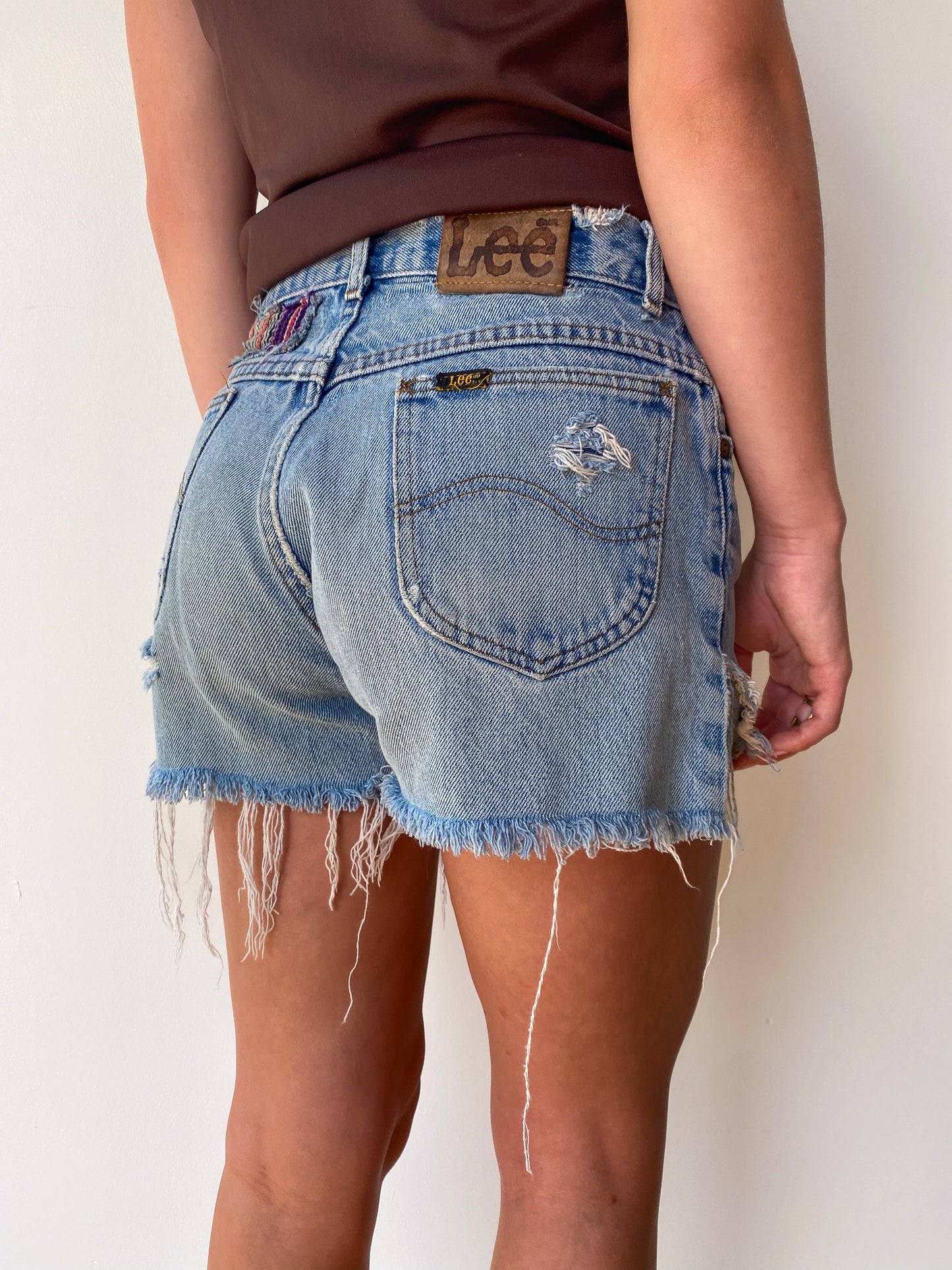 Lee Distressed & Patched Denim Shorts—[27]